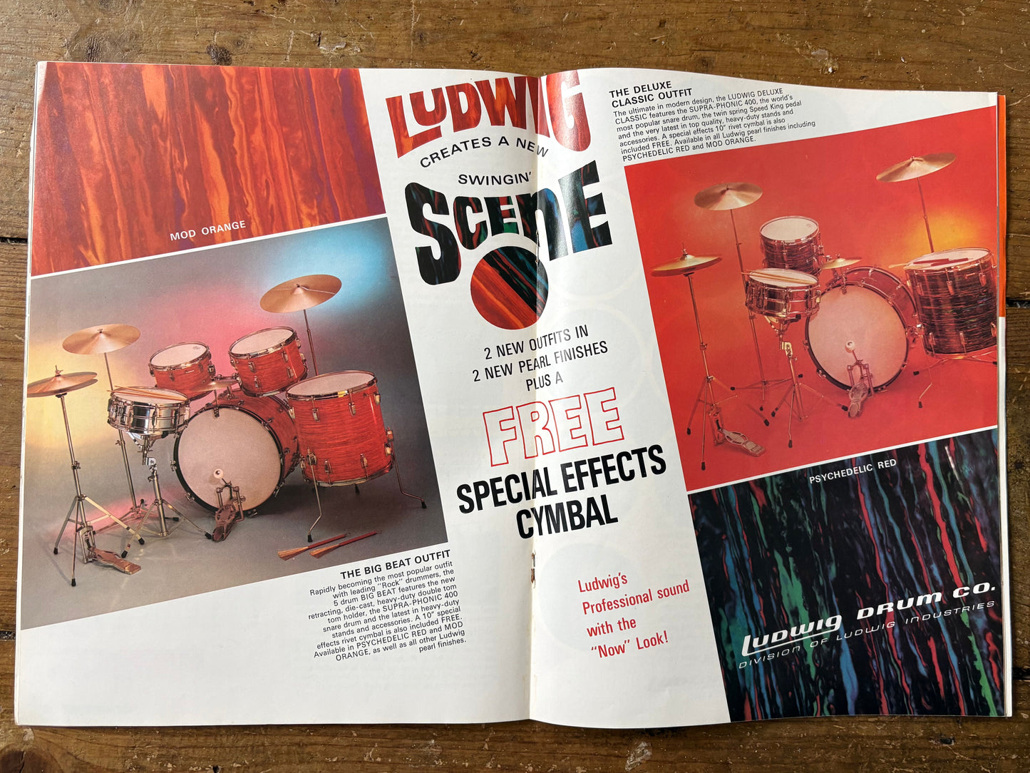 Open magazine ad for Ludwig drums on a wooden surface