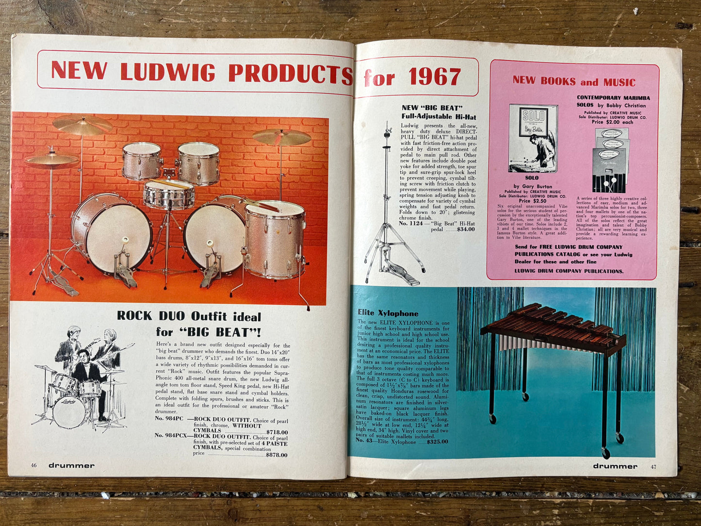 Open book showing vintage Ludwig drum set advertisement and product catalog on a wooden surface